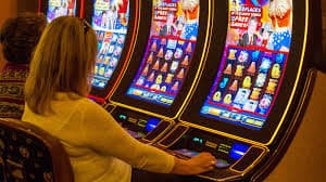 Live casino dealer table with cards and chips in online gaming session